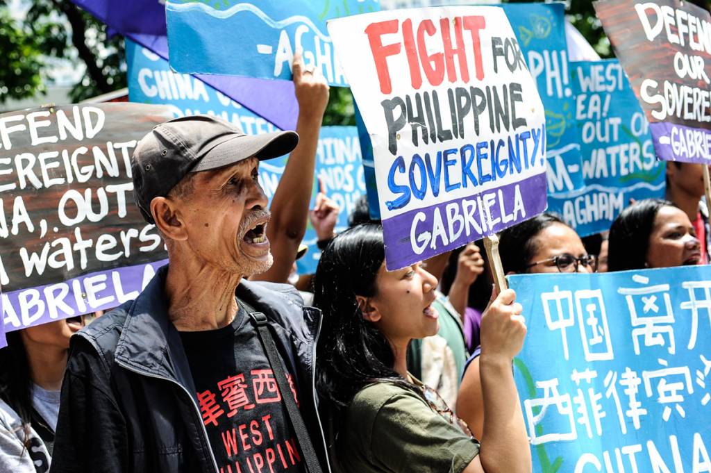 MANILA, PHILIPPINES - JULY 12: Anti China protestors mount a protest rally against China's territorial claims in the Spratlys group of islands in the South China Sea in front of the Chinese Consulate on July 12, 2016 in Makati, Philippines. The International Tribunal of the Permanent Court of Arbitration is expected to come out with a ruling today between the Philippines and China over the dispute in the South China Sea on Tuesday. The case was filed by the Philippines in 2013 since China took control of a reef about 140 miles from the Philippines coast although the People's Republic maintains it will not be bound by the ruling. (Photo by Dondi Tawatao/Getty Images)