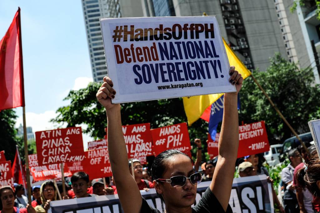 MANILA, PHILIPPINES - JULY 12: Anti China protestors mount a protest rally against China's territorial claims in the Spratlys group of islands in the South China Sea in front of the Chinese Consulate on July 12, 2016 in Makati, Philippines. The International Tribunal of the Permanent Court of Arbitration is expected to come out with a ruling today between the Philippines and China over the dispute in the South China Sea on Tuesday. The case was filed by the Philippines in 2013 since China took control of a reef about 140 miles from the Philippines coast although the People's Republic maintains it will not be bound by the ruling. (Photo by Dondi Tawatao/Getty Images)