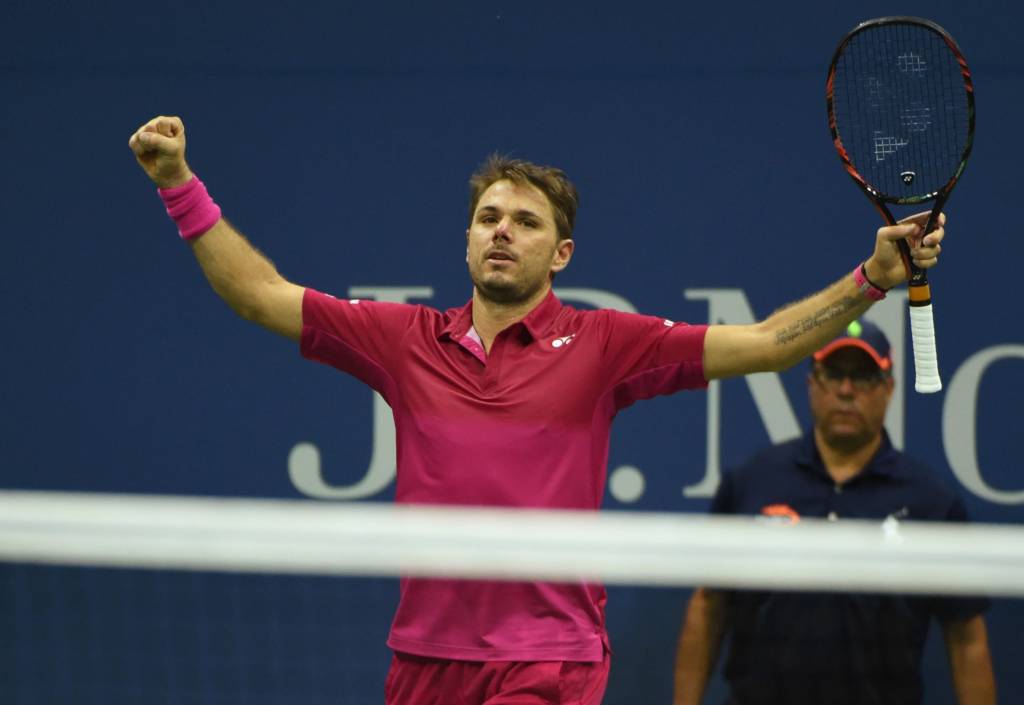 Tay vợt Thụy Sĩ Stan Wawrinka, giơ hai tay lên trời vui mừng sau khi đánh bại Kei Nishikori của Nhật trong trận bán kết đơn nam US Open 2016 diễn ra tại USTA Billie Jean King National Tennis Center, New York ngày 9 tháng 9, 2016. (Hình: Getty Images)