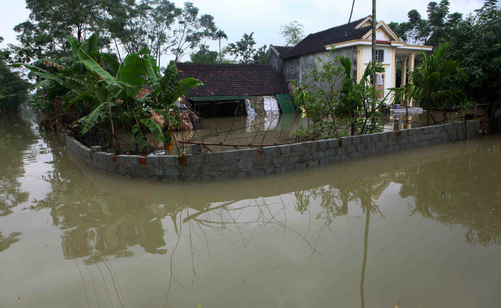 This picture taken on October 16, 2016 shows flooded homes in a village in the central province of Quang Binh. Severe flooding in central Vietnam has killed at least 25 people and destroyed thousands of homes, officials said on October 17, as the country braced for further destruction with a typhoon barrelling closer. / AFP / Vietnam News Agency / STR (Photo credit should read STR/AFP/Getty Images)