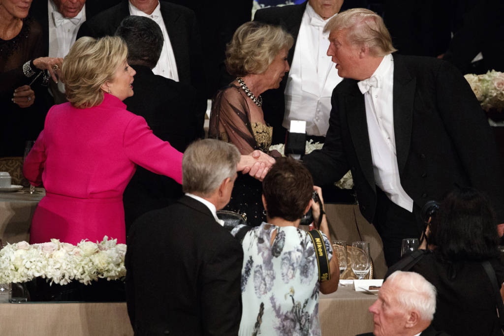 Republican presidential candidate Donald Trump, right, shakes hands with Democratic presidential candidate Hillary Clinton during the Alfred E. Smith Memorial Foundation dinner, Thursday, Oct. 20, 2016, in New York. (AP Photo/ Evan Vucci)
