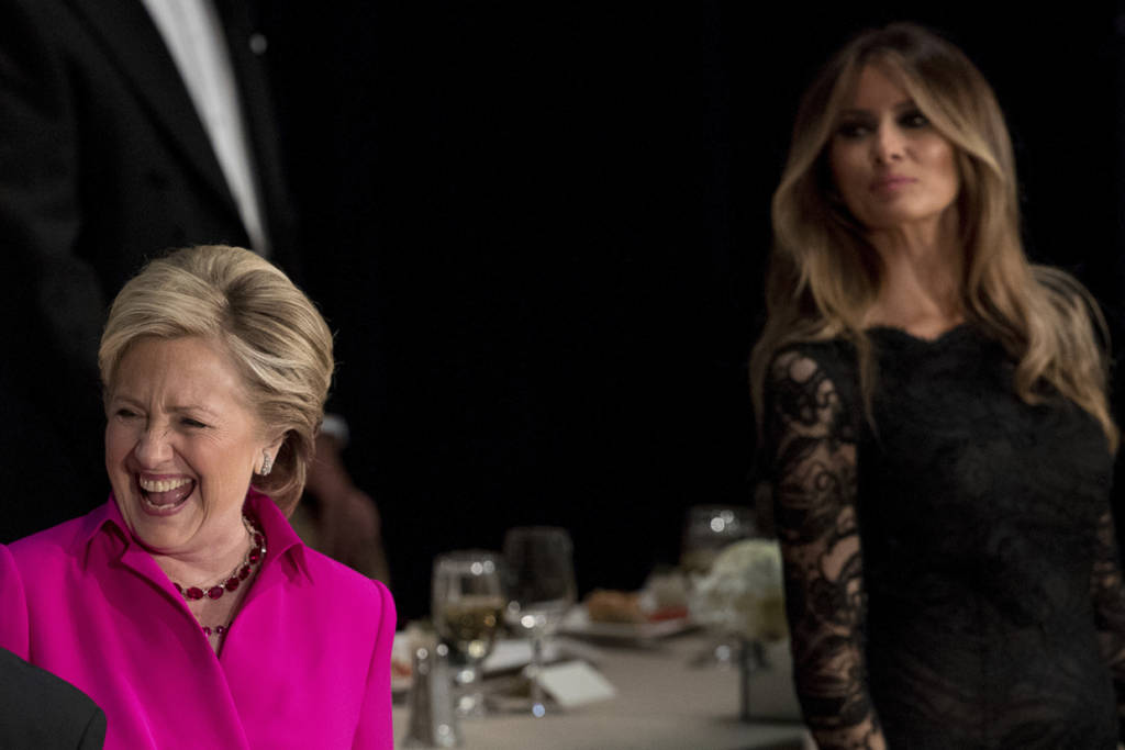 Democratic presidential candidate Hillary Clinton, left, stands near Melania Trump, right, as she arrives at the 71st annual Alfred E. Smith Memorial Foundation Dinner, a charity gala organized by the Archdiocese of New York and attended by Republican presidential candidate Donald Trump, Thursday, Oct. 20, 2016, at the Waldorf Astoria hotel in New York. (AP Photo/Andrew Harnik)