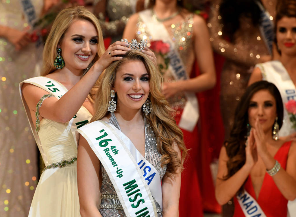 Newly selected 2016 Miss International 4th runner-up Miss USA Kaitryana Leinbach (R) receives her crown from 2015 Miss International 4th runner-up Miss USA Rindsay Becker (L) during the Miss International beauty pageant final in Tokyo on October 27, 2016. / AFP / TOSHIFUMI KITAMURA (Photo credit should read TOSHIFUMI KITAMURA/AFP/Getty Images)