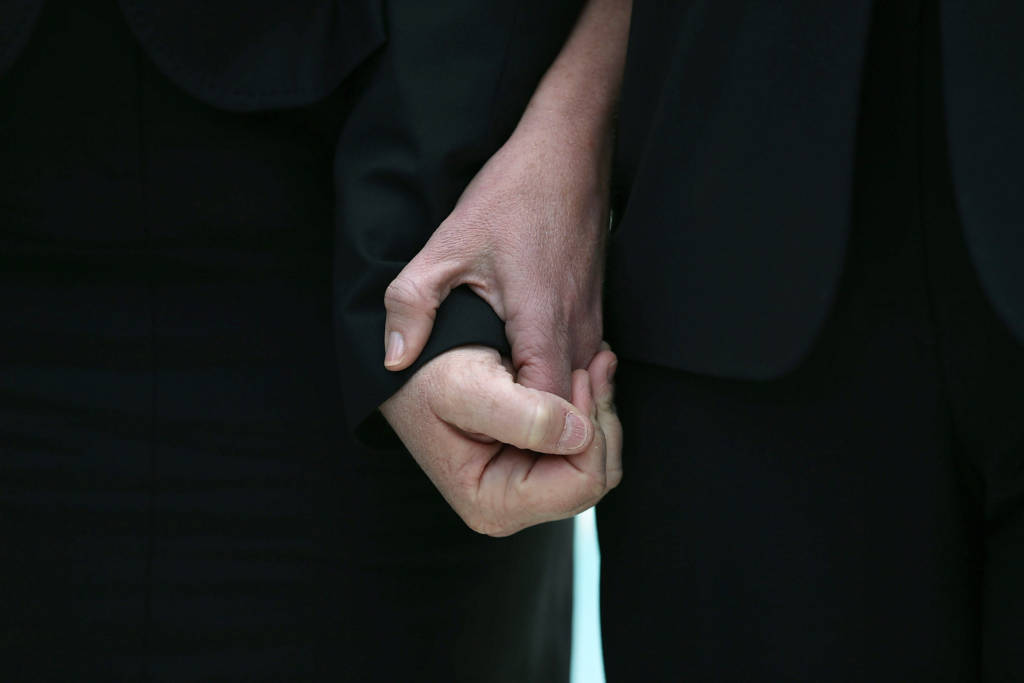 WASHINGTON, DC - MARCH 26: Plaintiff couple Sandy Steier (L) and Kris Perry hold hands after attending oral arguments at the U.S. Supreme Court after oral arguments, on March 26, 2013 in Washington, DC. Today the high court heard arguments in California's Proposition 8, the controversial ballot initiative that defines marriage as between a man and a woman. (Photo by Mark Wilson/Getty Images)