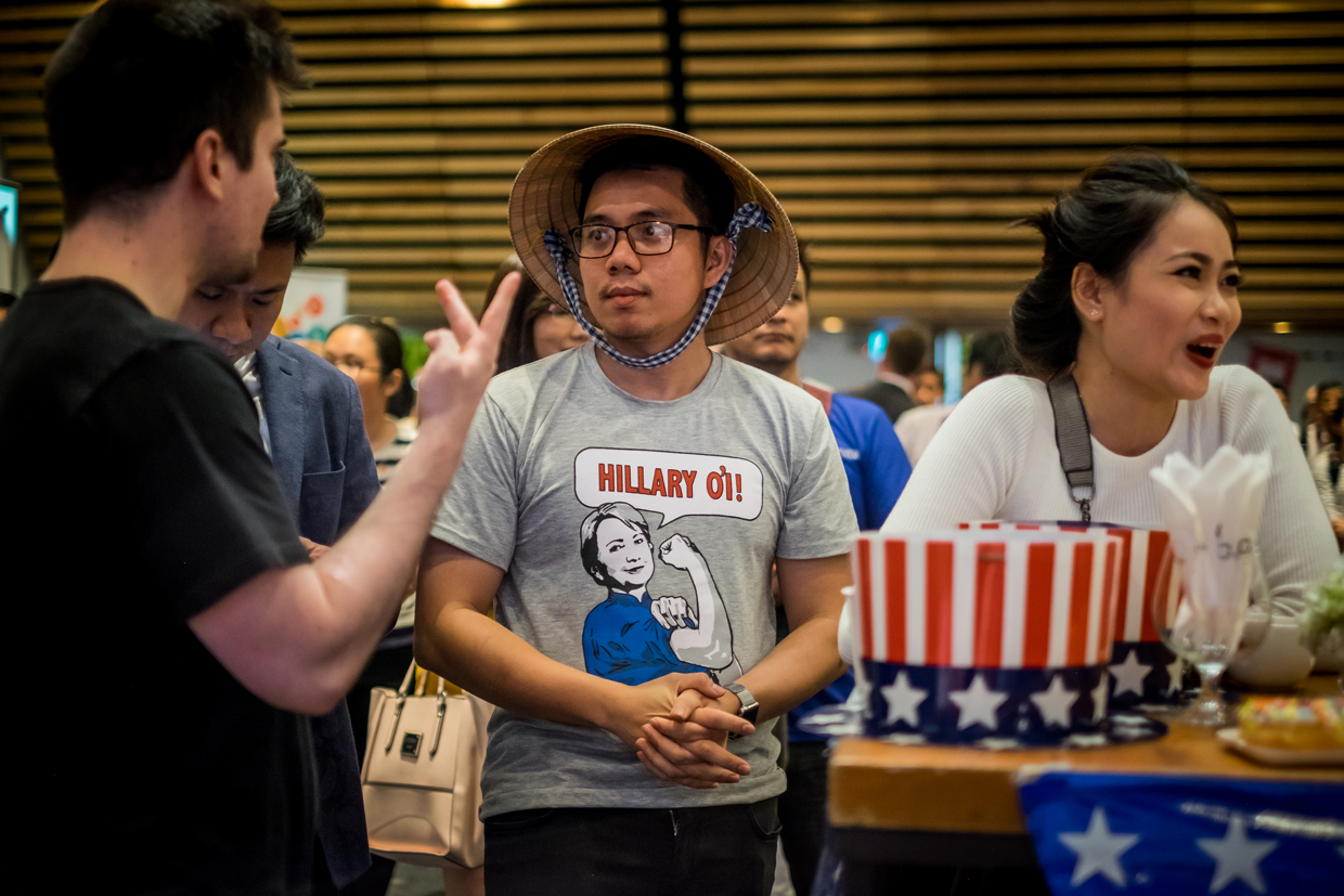 HO CHI MINH CITY, VIETNAM - NOVEMBER 09: People watch live election results hosted by the United States Consulate General at a convention center on November 9, 2016 in Ho Chi Minh City, Vietnam. Donald Trump's stunning performance in the US presidential election triggered shock and angst in Asia, where observers fretted over the implications for everything from trade to human rights and climate change. (Photo by Linh Pham/Getty Images)