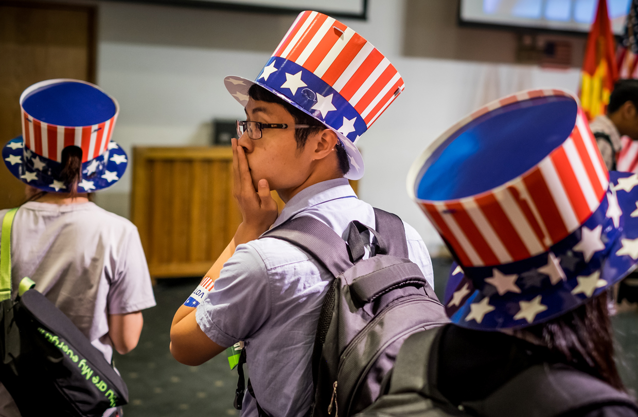 HO CHI MINH CITY, VIETNAM - NOVEMBER 09: People watch live election results hosted by the United States Consulate General at a convention center on November 9, 2016 in Ho Chi Minh City, Vietnam. Donald Trump's stunning performance in the US presidential election triggered shock and angst in Asia, where observers fretted over the implications for everything from trade to human rights and climate change. (Photo by Linh Pham/Getty Images)