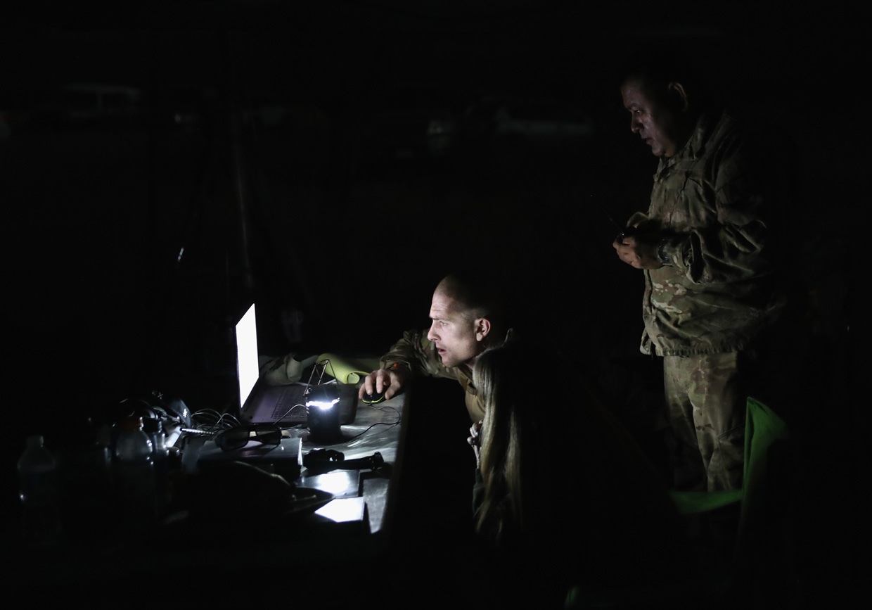 ARIVACA, AZ - NOVEMBER 14: Civilian paramilitaries with Arizona Border Recon decode intelligence on a smuggling cartel near the U.S.-Mexico border on November 14, 2016 near Arivaca, Arizona. The armed group, made up mostly of former U.S. military servicemen and women, stages intelligence and reconnaissance operations against drug and human smuggling operations in remote border areas. The group, which claims up to 200 volunteers, does not consider itself a militia, but rather a group of citizens supplementing U.S. Border Patrol efforts to counter illegal border activity. With the election of Donald Trump as President, border security issues are a top national issue for the incoming Administration. (Photo by John Moore/Getty Images)