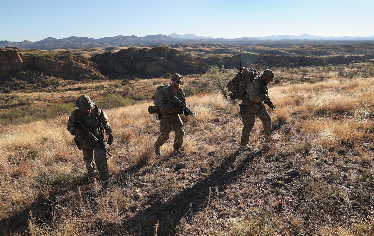 ARIVACA, AZ - NOVEMBER 14: Civilian paramilitaries with Arizona Border Recon search for a illegal immigrants and drug smugglers at the U.S.-Mexico border on November 14, 2016 near Arivaca, Arizona. The armed group, made up mostly of former U.S. military servicemen and women, stages reconnaissance and surveillance operations against drug and human smuggling operations in remote border areas. The group, which claims up to 200 volunteers, does not consider itself a militia, but rather a group of citizens supplimenting U.S. Border Patrol efforts to control illegal border activity. With the election of Donald Trump as President, border security issues are a top national issue for the incoming Administration. (Photo by John Moore/Getty Images)