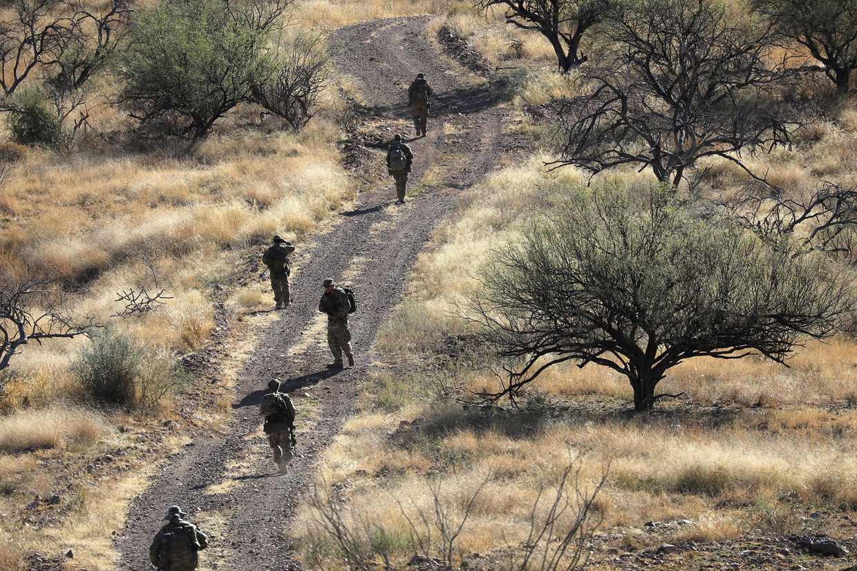 ARIVACA, AZ - NOVEMBER 14: Civilian paramilitaries with Arizona Border Recon search for a illegal immigrants and drug smugglers near the U.S.-Mexico border on November 14, 2016 near Arivaca, Arizona. The armed group, made up mostly of former U.S. military servicemen and women, stages reconnaissance and surveillance operations against drug and human smuggling operations in remote border areas. The group, which claims up to 200 volunteers, does not consider itself a militia, but rather a group of citizens supplimenting U.S. Border Patrol efforts to control illegal border activity. With the election of Donald Trump as President, border security issues are a top national issue for the incoming Administration. (Photo by John Moore/Getty Images)