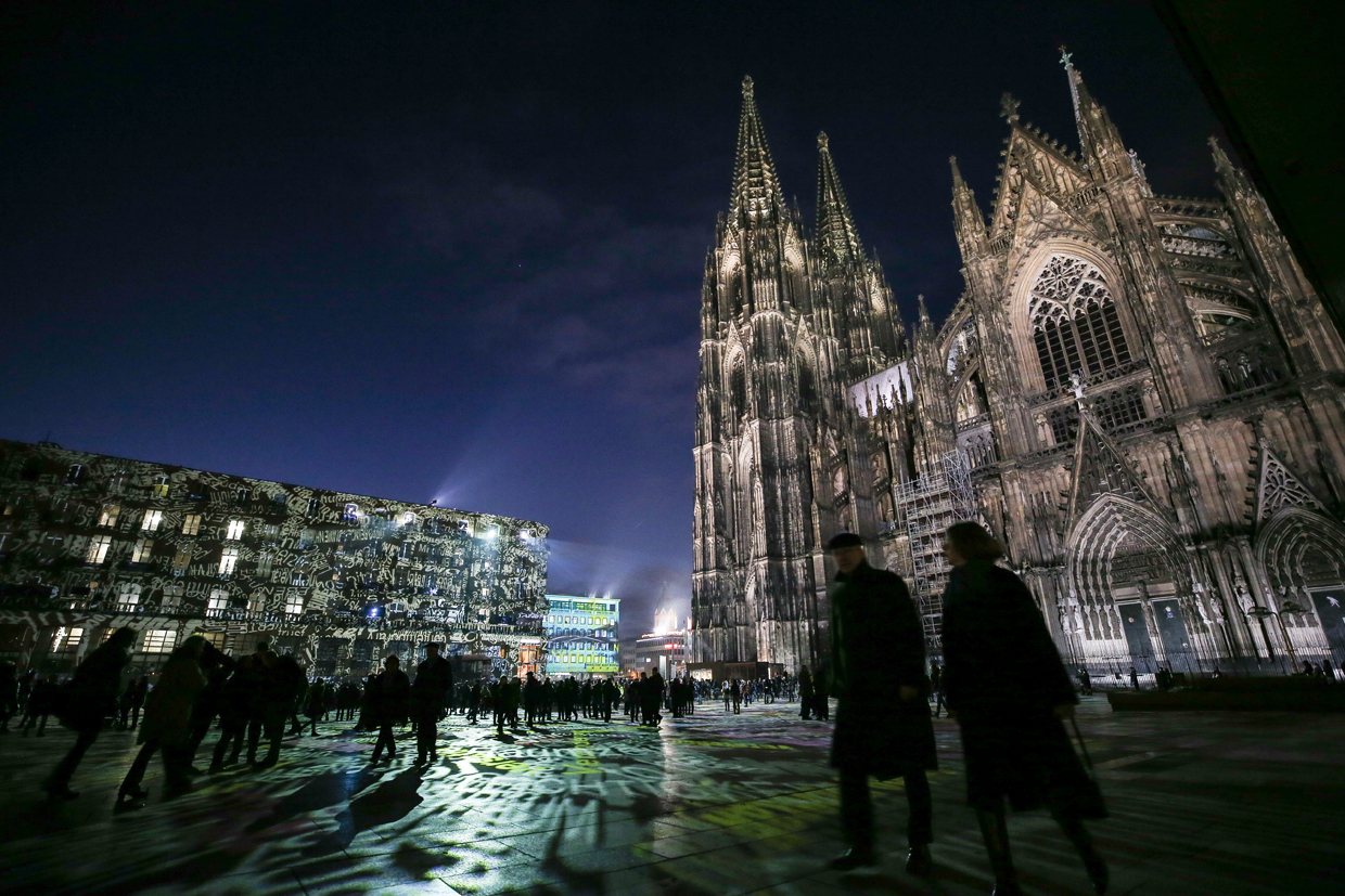 COLOGNE, GERMANY - DECEMBER 31: Visitors walk past in front of Cologne Cathedral not far from where on New Year's Eve one year ago hundreds of apparently coordinated sexual assaults were perpetrated against women, prior to New Year's Eve celebrations on December 31, 2016 in Cologne, Germany. City authorities have deployed around 1,500 police officers - more than 10 times last year's number, to maintain security during this year's festivities. Security across Germany is high due also to the recent Berlin terror attack, in which suspect Anis Amri drove a truck into a Christmas market and killed 12 people. (Photo by Maja Hitij/Getty Images)