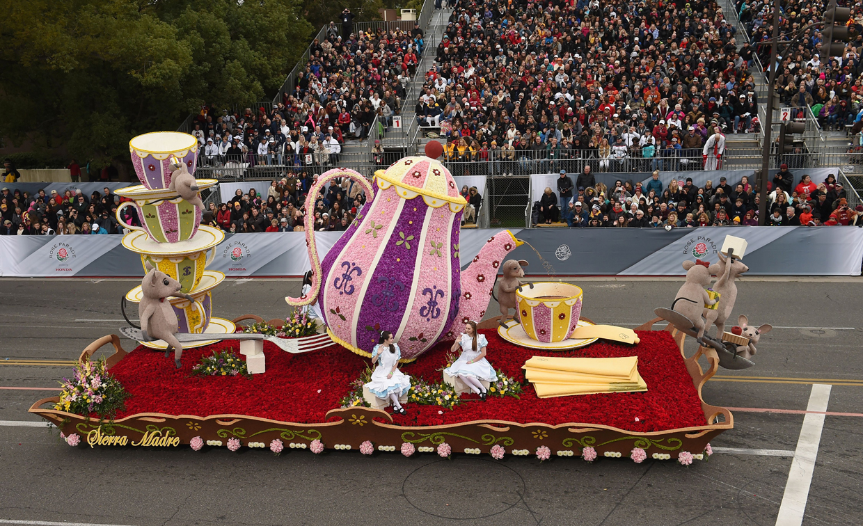 The city of Sierra Madre's The Cats Away float participates in the 128th Rose Parade in Pasadena, California, January 2, 2017. The Rose Parade, also known as the Tournament of Roses Parade, is part of "America's New Year Celebration" held in Pasadena, California each year on New Year's Day, or on January 2 if New Year's Day falls on a Sunday. The parade's Never on Sunday tradition dates to 1893, the first year since the start of the event that New Years Day fell on a Sunday. To avoid frightening horses that would be hitched outside churches on a Sunday the parade was moved to the next day, January 2. / AFP / Robyn Beck (Photo credit should read ROBYN BECK/AFP/Getty Images)