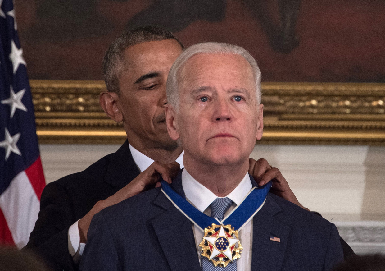 US President Barack Obama awards Vice President Joe Biden the Presidential Medal of Freedom during a tribute to Biden at the White House in Washington, DC, on January 12, 2017. / AFP / NICHOLAS KAMM (Photo credit should read NICHOLAS KAMM/AFP/Getty Images)