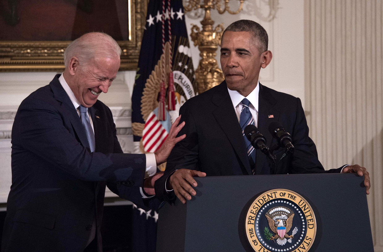 US Vice President Joe Biden laughs as President Barack Obama speaks during a tribute to Biden at the White House in Washington, DC, on January 12, 2017. / AFP / NICHOLAS KAMM (Photo credit should read NICHOLAS KAMM/AFP/Getty Images)