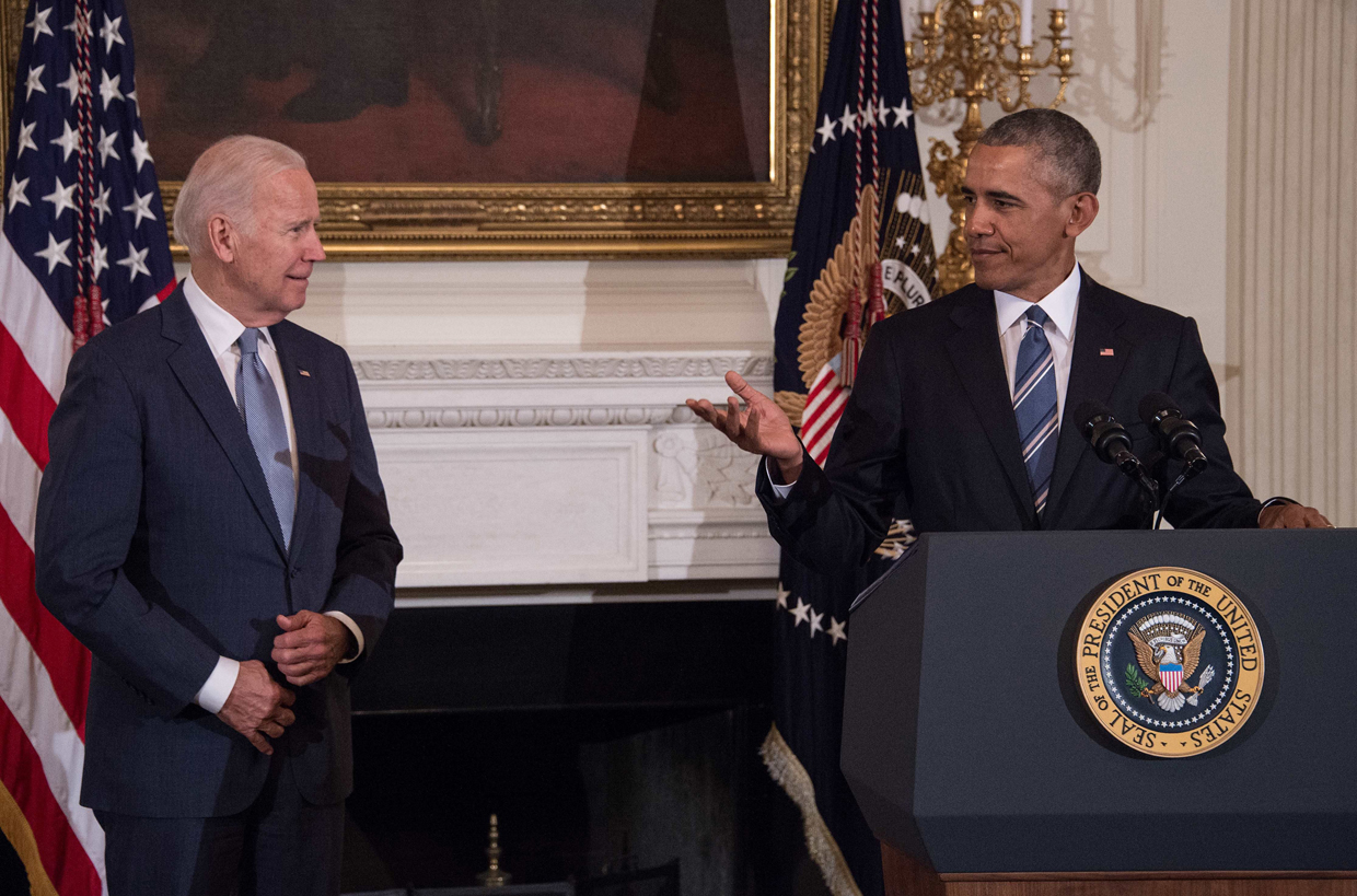 US Vice President Joe Biden listens to President Barack Obama speak during a tribute to Biden at the White House in Washington, DC, on January 12, 2017. / AFP / NICHOLAS KAMM (Photo credit should read NICHOLAS KAMM/AFP/Getty Images)