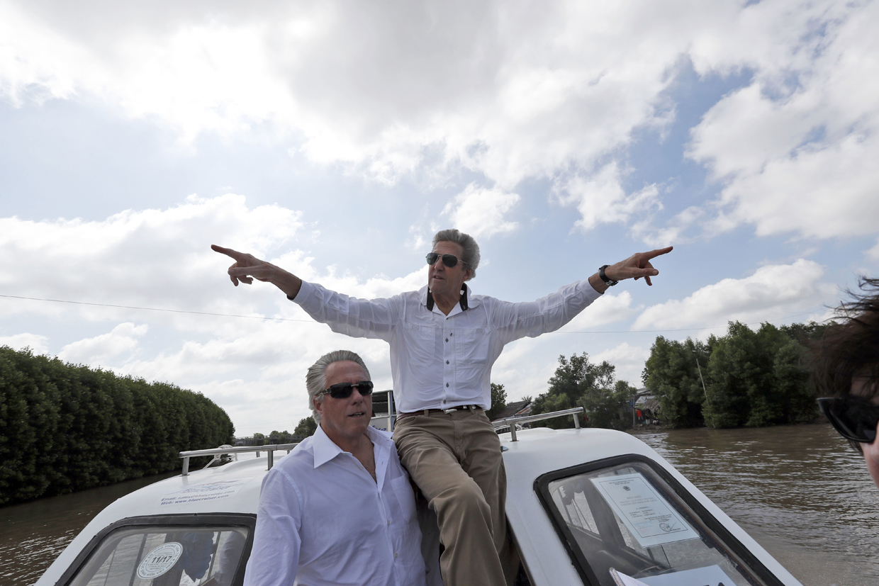 US Secretary of State John Kerry (R) rides a boat with US Senior Advisor to the Secretary David Thorne in the Mekong River Delta on January 14, 2017. Kerry is in Vietnam, his fourth and final trip to the communist nation where he served during the war. / AFP / POOL / Alex Brandon (Photo credit should read ALEX BRANDON/AFP/Getty Images)