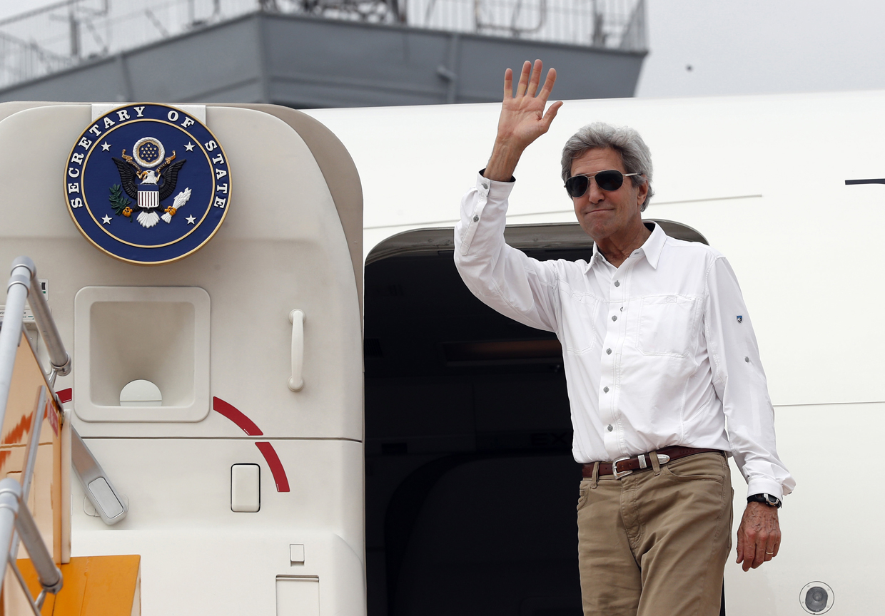 US Secretary of State John Kerry waves as he boards his plane to depart Tan Son Nhat International Airport on January 14, 2017, in Ho Chi Minh City, Vietnam. Kerry is in Vietnam, his fourth and final trip to the communist nation where he served during the war. / AFP / POOL / Alex Brandon (Photo credit should read ALEX BRANDON/AFP/Getty Images)