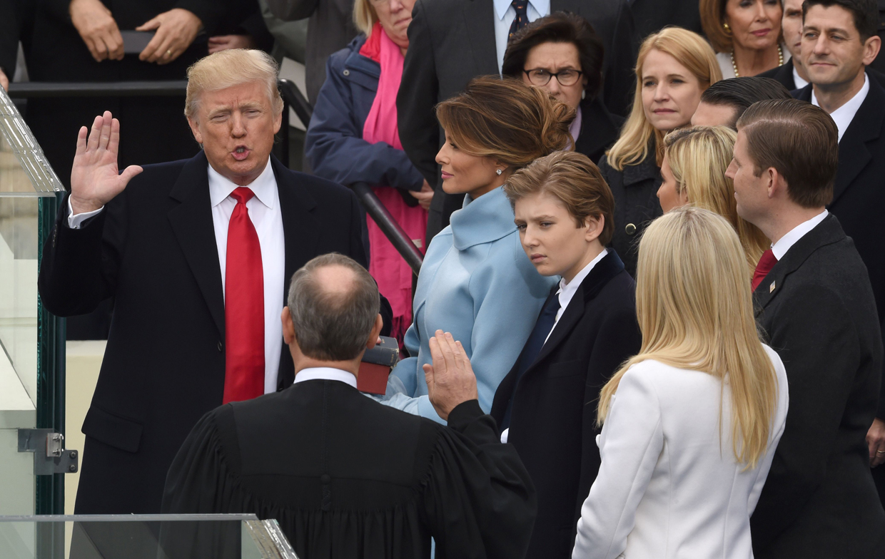 Donald Trump (L) is sworn in as the 45th US president by Supreme Court Chief Justice John Roberts in front of the Capitol in Washington on January 20, 2017. / AFP / Timothy A. CLARY (Photo credit should read TIMOTHY A. CLARY/AFP/Getty Images)