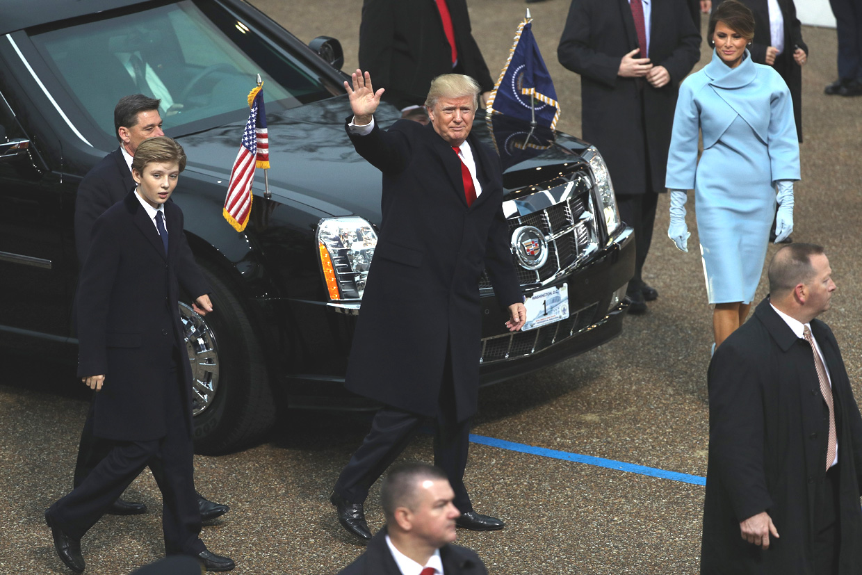 WASHINGTON, DC - JANUARY 20: U.S. President Donald Trump (C) waves to supporters as he walks the parade route with first lady Melania Trump (R) and son Barron Trump (L) during the Inaugural Parade on January 20, 2017 in Washington, DC. Donald J. Trump was sworn in today as the 45th president of the United States. (Photo by Patrick Smith/Getty Images)