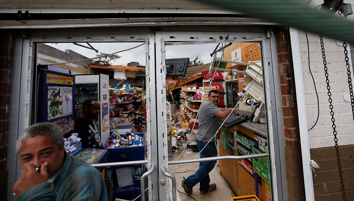 NEW ORLEANS, LA - FEBRUARY 07: A man stands inside his business after a tornado ripped off his roof on February 7, 2017 in New Orleans, Louisiana. According to the weather service 25 people were injured in the aftermath of the tornado. (Photo by Sean Gardner/Getty Images)