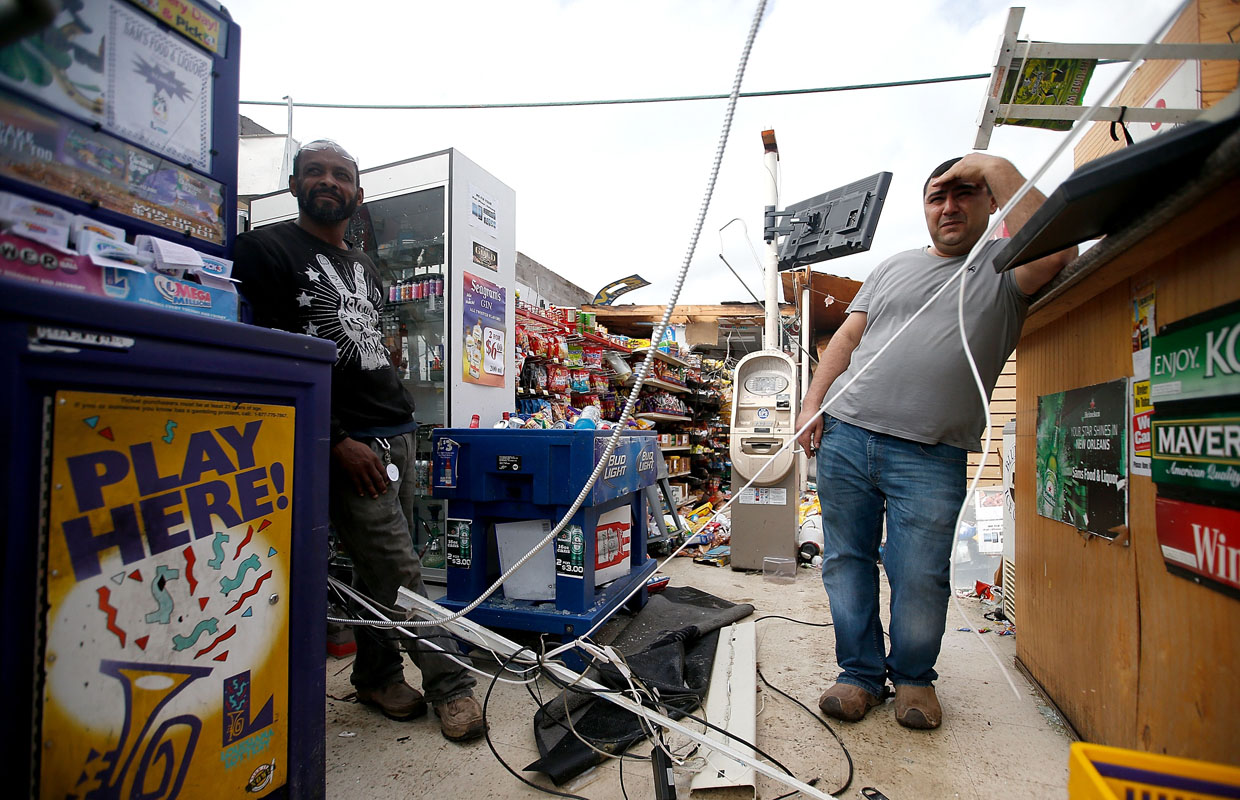 NEW ORLEANS, LA - FEBRUARY 07: A man stands inside his buisnnes after a tornado ripped off his roof on February 7, 2017 in New Orleans, Louisiana. According to the weather service, 25 people were injured in the aftermath of the tornado. (Photo by Sean Gardner/Getty Images)