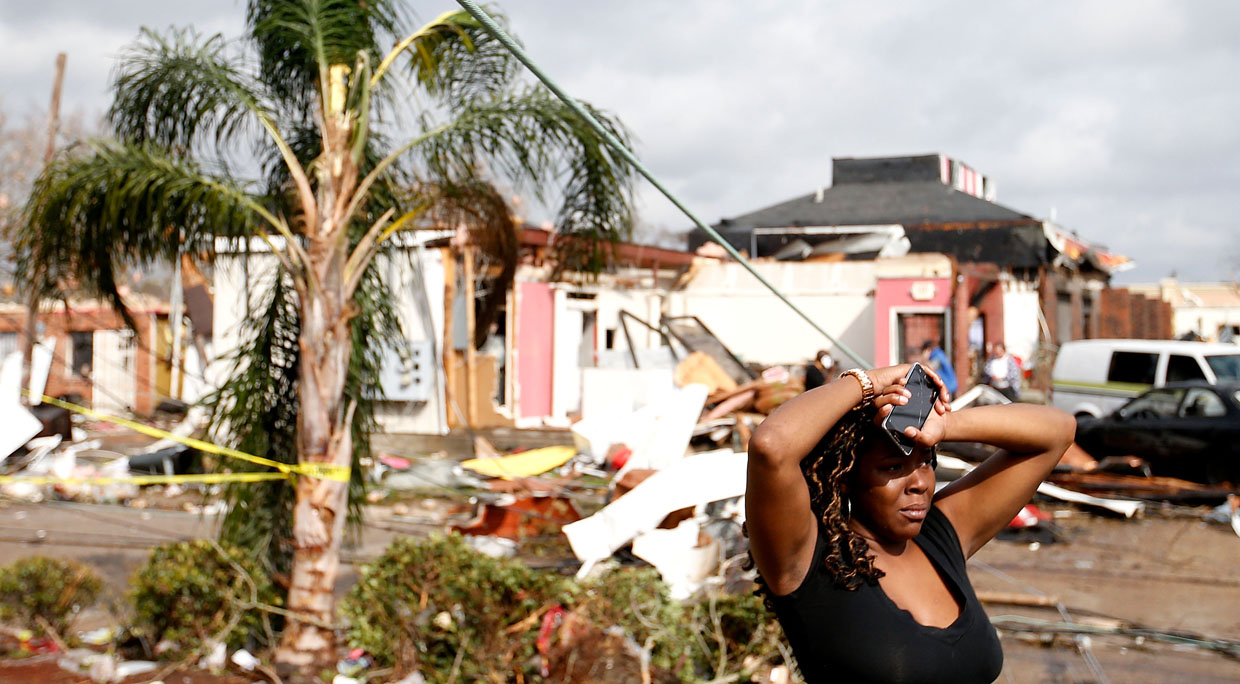 NEW ORLEANS, LA - FEBRUARY 07: A woman looks at the wreckage caused by a tornado which touched down along Chef Menture Avenue on February 7, 2017 in New Orleans, Louisiana. According to the weather service 25 people were injured in the aftermath of the tornado. (Photo by Sean Gardner/Getty Images)