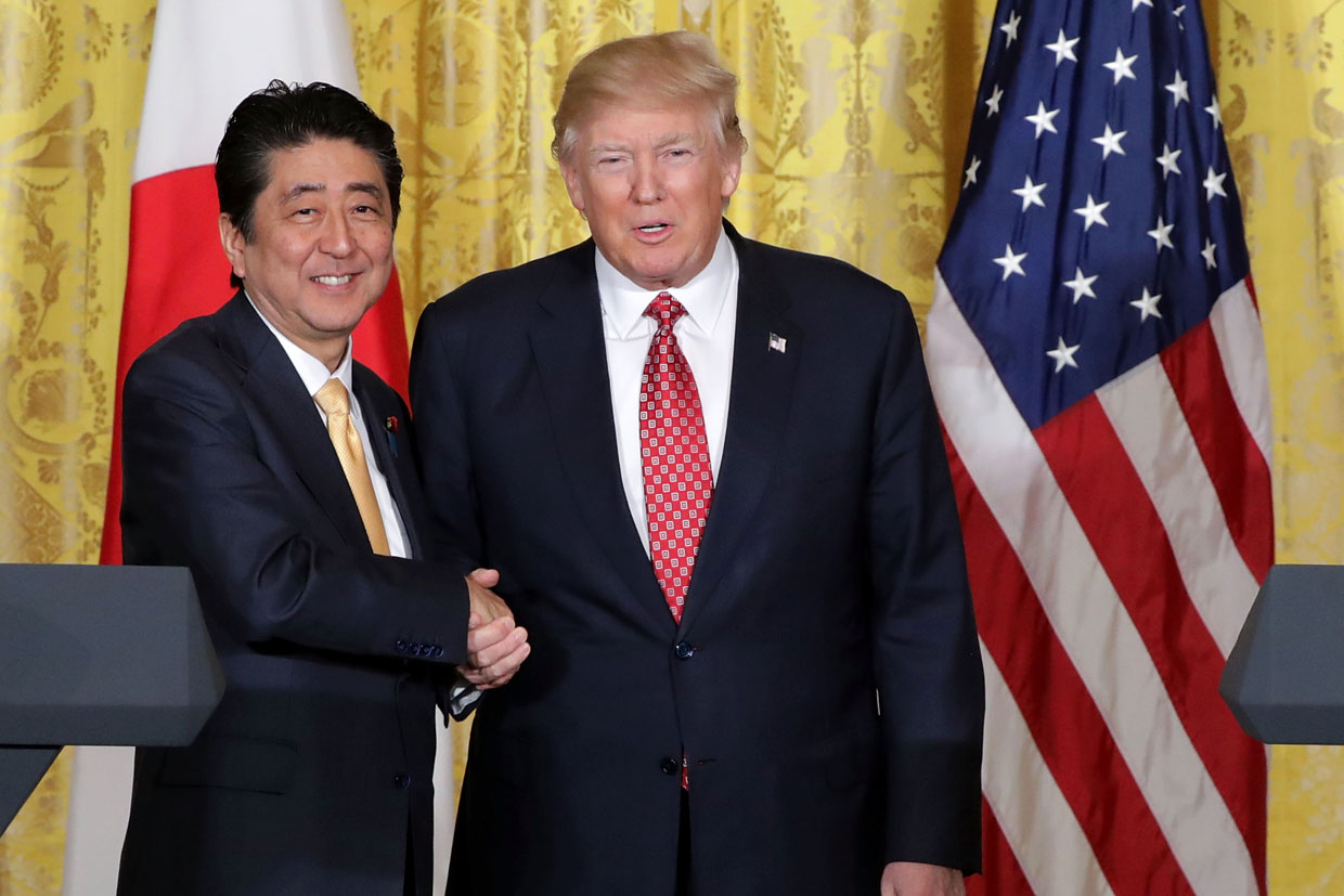 WASHINGTON, DC - FEBRUARY 10: U.S. President Donald Trump and Japanese Prime Minister Shinzo Abe shake hands at the conclusion of a joint news conference in the East Room at the White House February 10, 2017 in Washington, DC. Trump and Abe held bilateral meetings earlier in the day and discussed many issues, including trade and security ties. (Photo by Chip Somodevilla/Getty Images)
