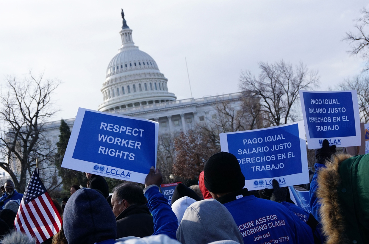Labor activists demonstrate on February 16, 2017, after Andrew Puzder withdrew from his nomination as US Labor Secretary. Puzder withdrew on February 15 from consideration after facing intense scrutiny for his business record and controversies about his personal past. / AFP / MANDEL NGAN (Photo credit should read MANDEL NGAN/AFP/Getty Images)