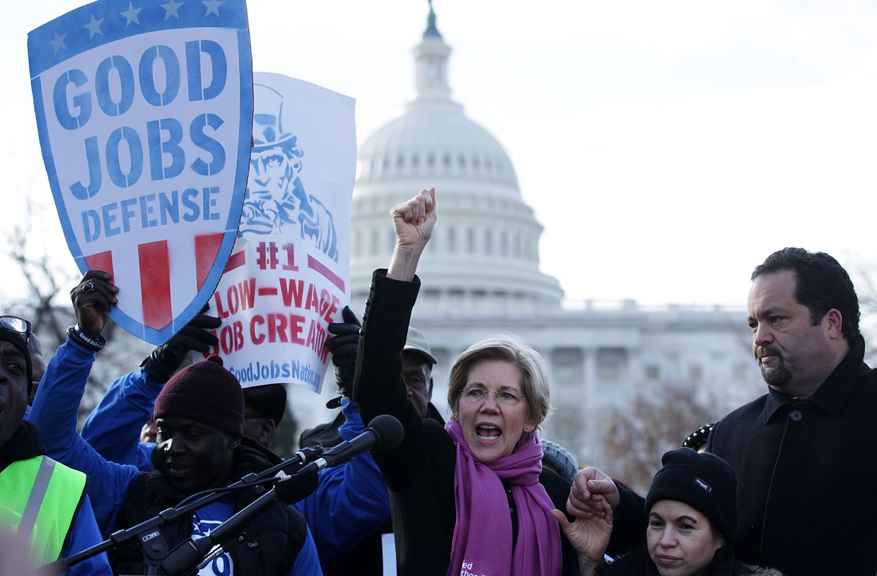WASHINGTON, DC - FEBRUARY 16: U.S. Sen. Elizabeth Warren (D-MA) (C) speaks as former president and CEO of NAACP Ben Jealous (R) looks on during a rally "to fight-back against the Republican war on the working class" February 16, 2017 at Upper Senate Park on Capitol Hill in Washington, DC. Activists held a rally to celebrate Andrew Puzder's decision to withdraw from consideration to be secretary of labor and Òto hold [President] Trump accountable to the working class." (Photo by Alex Wong/Getty Images)