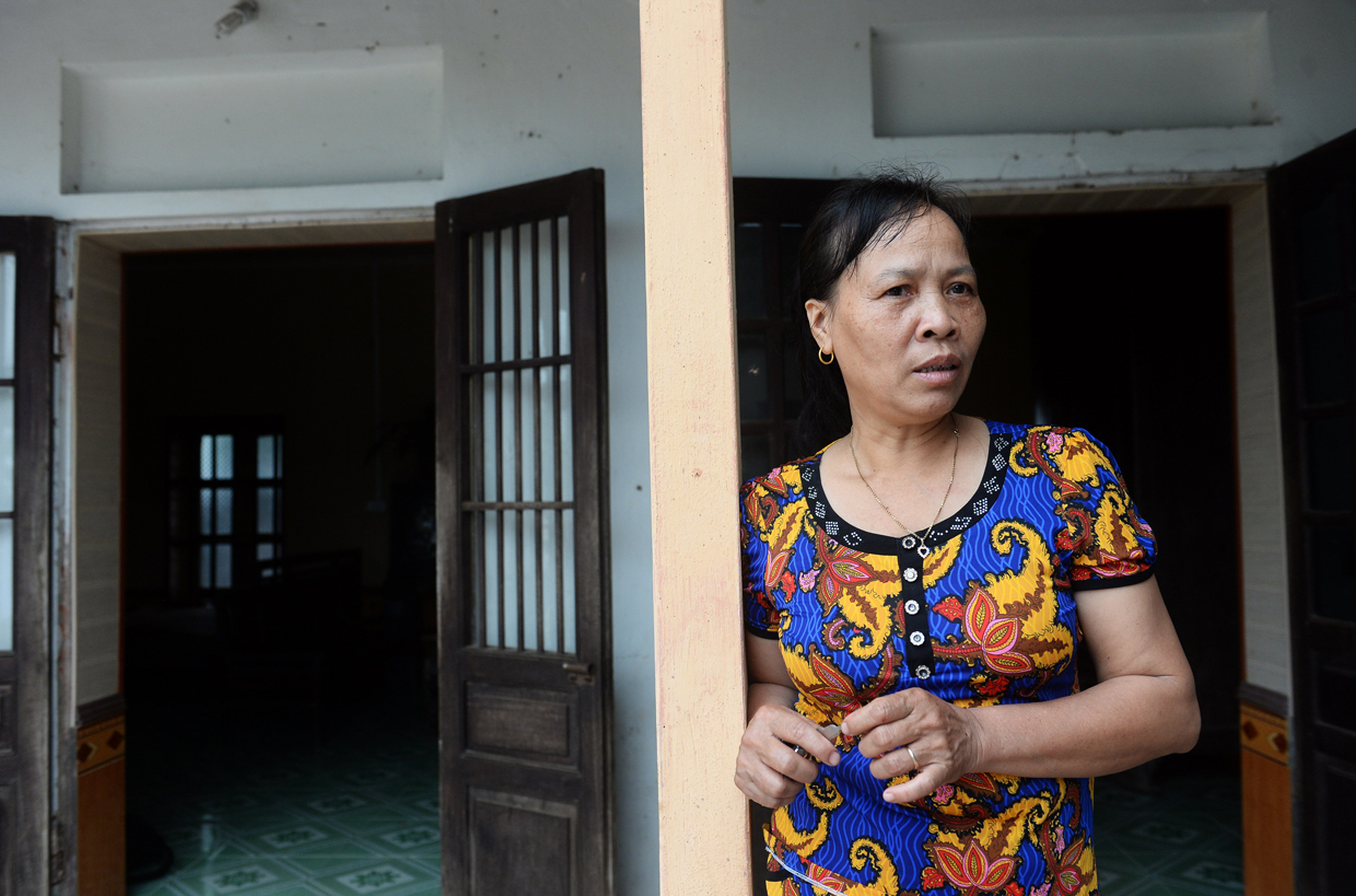 CORRECTION - Nguyen Thi Vy, 54, stepmother of Doan Thi Huong, a suspect involved in the assassination of Kim Jong-Un's half-brother, speaks as she stands at Huong's family home in Nghia Hung district, northern province of Nam Dinh on February 22, 2017. Detectives probing the assassination of Kim Jong-Un's half-brother want to question a North Korean diplomat, Malaysia's top policeman said. Royal Malaysian Police chief Khalid Abu Bakar said Vietnamese suspect Doan Thi Huong, 28, and Indonesian Siti Aishah, 25, had been trained to swab the man's face, practising in Kuala Lumpur before the assault at the airport. / AFP / HOANG DINH NAM / The erroneous mention[s] appearing in the metadata of this photo by HOANG DINH NAM has been modified in AFP systems in the following manner: [stepmother ] instead of [mother in law]. Please immediately remove the erroneous mention[s] from all your online services and delete it (them) from your servers. If you have been authorized by AFP to distribute it (them) to third parties, please ensure that the same actions are carried out by them. Failure to promptly comply with these instructions will entail liability on your part for any continued or post notification usage. Therefore we thank you very much for all your attention and prompt action. We are sorry for the inconvenience this notification may cause and remain at your disposal for any further information you may require. / (Photo credit should read HOANG DINH NAM/AFP/Getty Images)