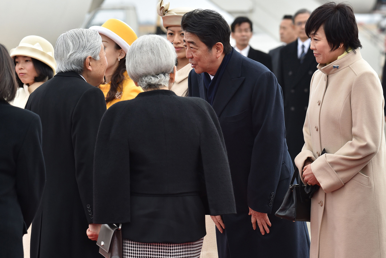 Japan's Prime Minister Shinzo Abe (2nd R) and his wife Akie (R) see off Emperor Akihito (L) and Empress Michiko (2nd L) as they leave for Vietnam from Tokyo's Haneda Airport on February 28, 2017. Japan's emperor left for Vietnam on February 28 to meet families of Japanese soldiers sent there by his father more than seven decades earlier during World War II. / AFP / Kazuhiro NOGI (Photo credit should read KAZUHIRO NOGI/AFP/Getty Images)