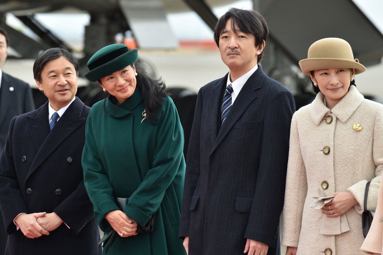 Japan's royal family members, Crown Prime Naruhito (L), Crown Princess Masako (2nd L), Prince Akishino (3rd L) and Princess Kiko (R) see off Emperor Akihito and Empress Michiko as they lave for Vietnam from Tokyo's Haneda Airport on February 28, 2017. Japan's emperor left for Vietnam on February 28 to meet families of Japanese soldiers sent there by his father more than seven decades earlier during World War II. / AFP / Kazuhiro NOGI (Photo credit should read KAZUHIRO NOGI/AFP/Getty Images)