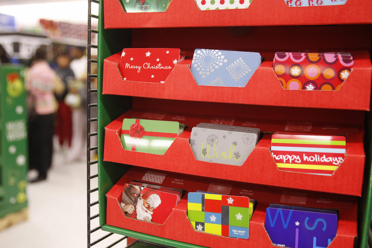 Gift cards are on display at a Wal-Mart store, in Panorama City, California, 23 November 2007. The day after Thanksgiving, known as "Black Friday," marks the start of the 2007 holiday shopping season with crowds of shoppers waiting overnight in long lines in the hopes of getting bargains on one of the busiest shopping days of the year. Gift cards are an increasingly popular way to give gifts, with some analysts suggest that the sales of gift cards will soon top 100 billion USD. AFP PHOTO / ROBYN BECK (Photo credit should read ROBYN BECK/AFP/Getty Images)