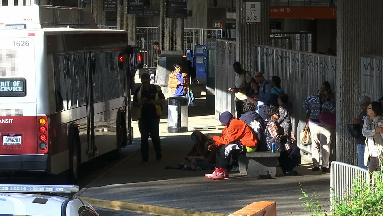 Commuters check wait for buses during the morning commute in Atlanta on Friday, March 31, 2017. Many commuters in some of Atlanta's densely populated northern suburbs will have to find alternate routes or ride public transit for the foreseeable future after a massive fire caused a bridge on Interstate 85 to collapse Thursday, completely shutting down the heavily traveled highway. (AP Photo/Alex Sanz)