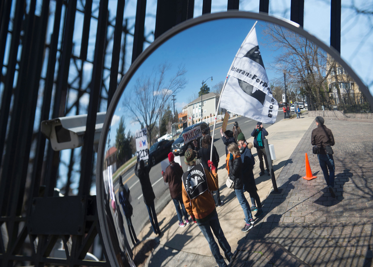 Protesters march against President Trump outside the Embassy of Russia on March 4, 2017, in Washington, DC. / AFP PHOTO / MOLLY RILEY (Photo credit should read MOLLY RILEY/AFP/Getty Images)