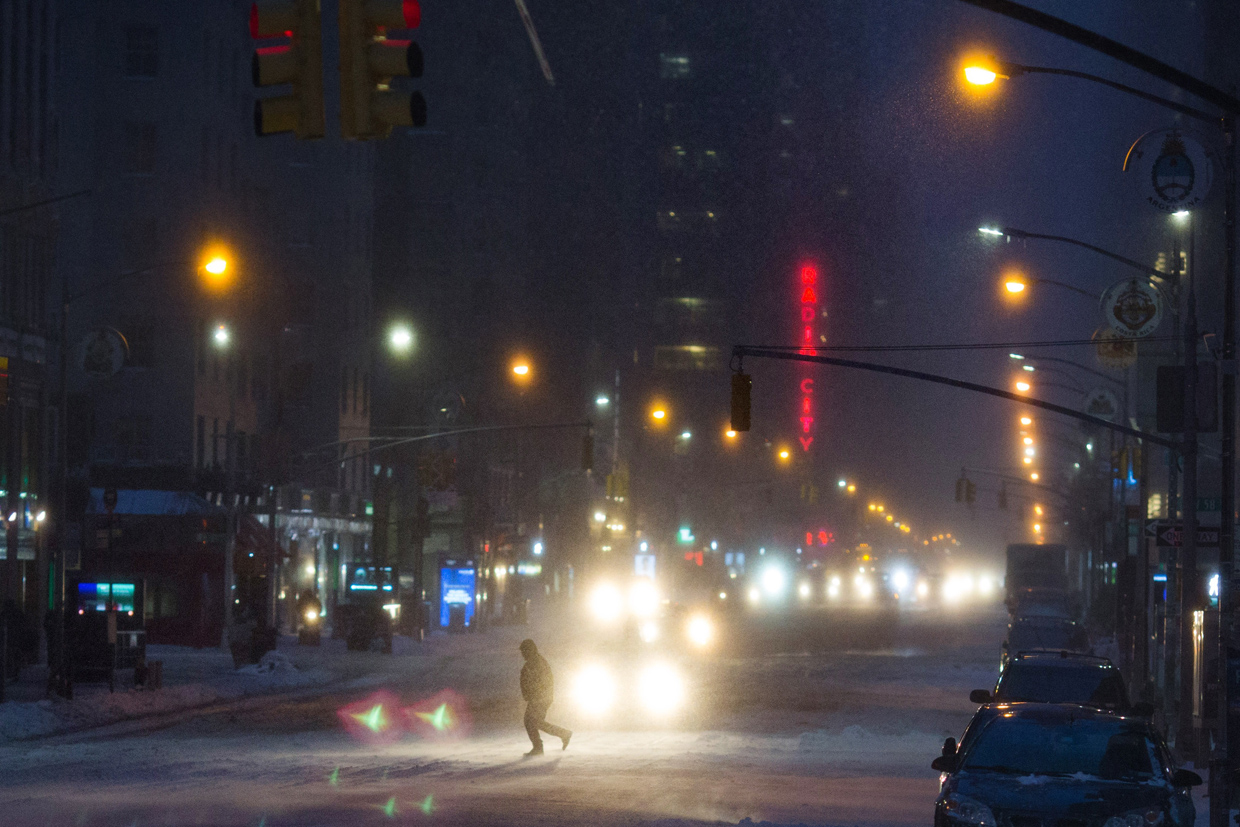 NEW YORK, NY - MARCH 14: Cars move through the snow during a day of heavy snow and freezing rain on March 14, 2017 in New York City. Much of the Northeast is under a state of emergency as a blizzard is expected to bring over one foot of snow and high winds to the area. (Photo by Kevin Hagen/Getty Images)