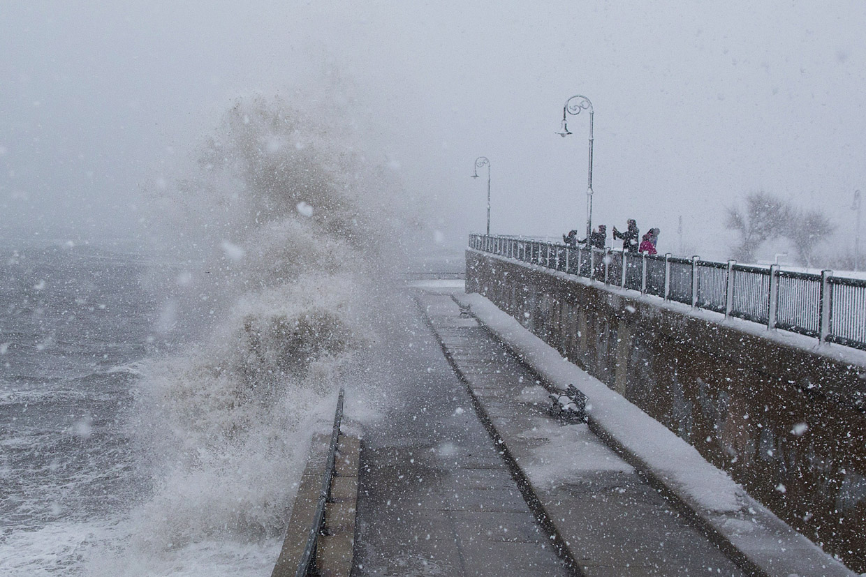 LYNN, MA - MARCH 14: People watch as waves crash over the seawall along Lynn Shore Drive as Winter Storm Stella bears down on March 14, 2017 in Lynn, Massachusetts. (Photo by Scott Eisen/Getty Images)