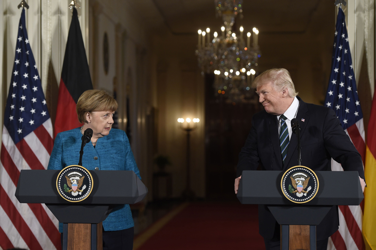 US President Donald Trump and German Chancellor Angela Merkel hold a joint press conference in the East Room of the White House in Washington, DC, on March 17, 2017. / AFP PHOTO / SAUL LOEB (Photo credit should read SAUL LOEB/AFP/Getty Images)