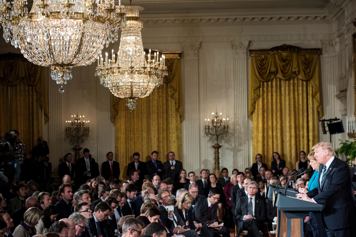 US President Donald Trump and German Chancellor Angela Merkel hold a joint press conference in the East Room of the White House in Washington, DC, on March 17, 2017. / AFP PHOTO / Brendan Smialowski (Photo credit should read BRENDAN SMIALOWSKI/AFP/Getty Images)