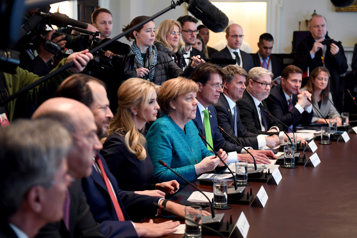 WASHINGTON, DC - MARCH 17: (AFP OUT) German Chancellor Angela Merkel (C) and Ivanka Trump (left center) particapate in a roundtable discussion on vocational training with United States and German business leaders lead by President Donald Trump (not seen) in the Cabinet Room of the White Houseon March 17, 2017 in Washington, DC. In Merkel's first U.S. visit under the Trump administration, the two leaders discussed strengthening NATO, fighting the Islamic State group, and the ongoing conflict in Ukraine. (Photo by Pat Benic-Pool/Getty Images)