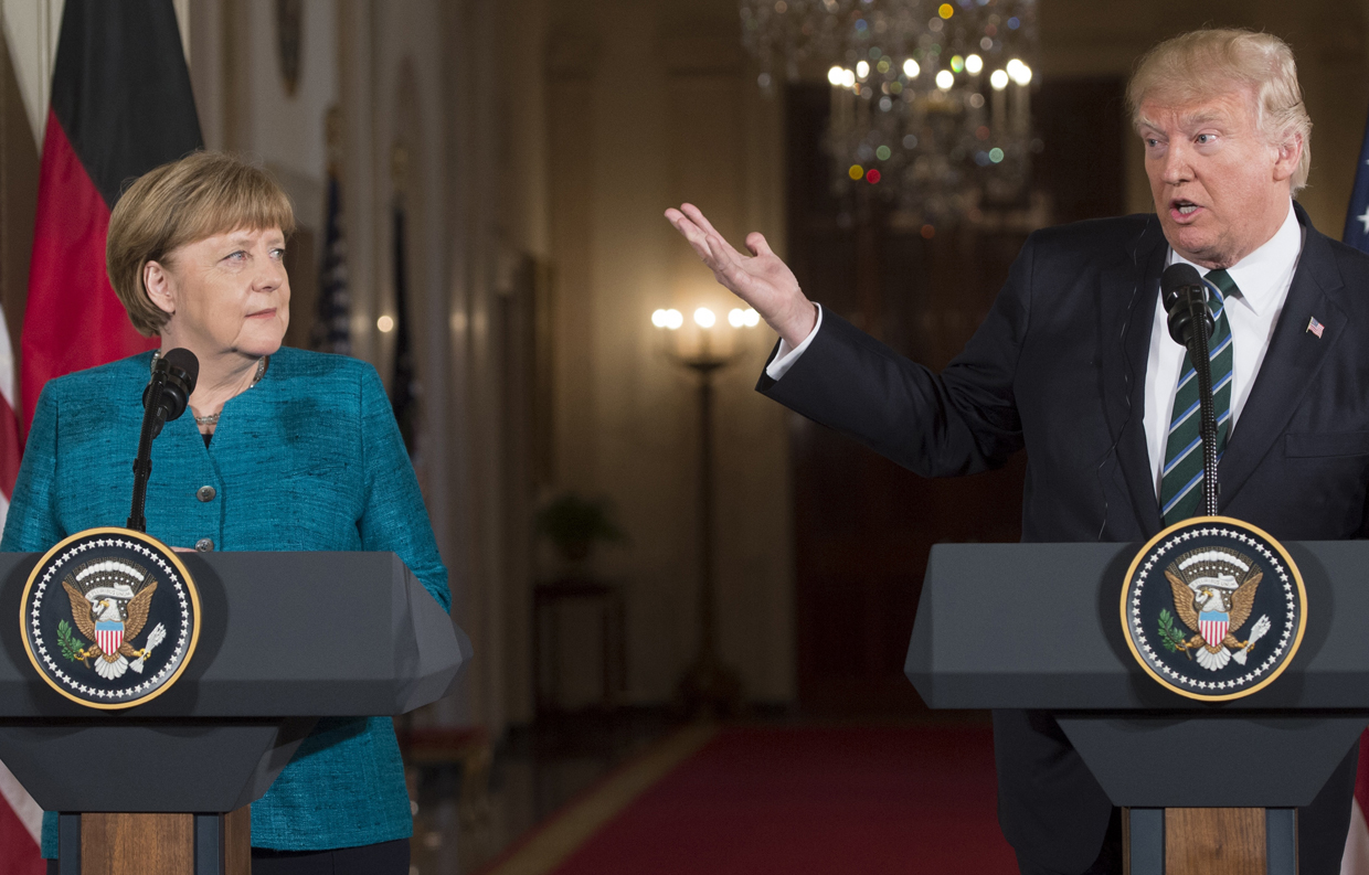 US President Donald Trump and German Chancellor Angela Merkel hold a joint press conference in the East Room of the White House in Washington, DC, on March 17, 2017. / AFP PHOTO / SAUL LOEB (Photo credit should read SAUL LOEB/AFP/Getty Images)