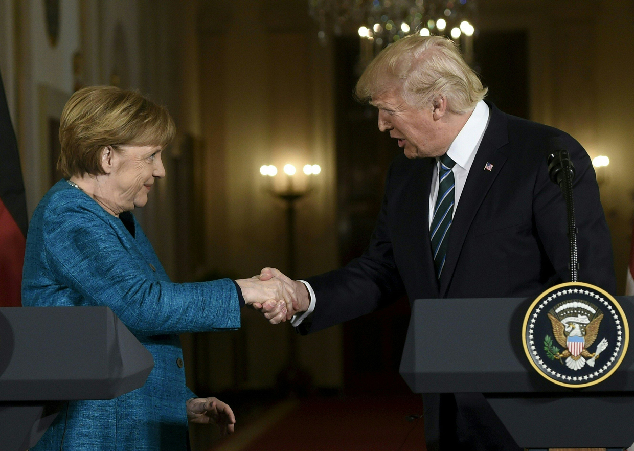 US President Donald Trump and Germany's Chancellor Angela Merkel shake hands after a press conference in the East Room of the White House March 17, 2017 in Washington, DC. Trump said Friday he and Merkel agreed on the need for a "peaceful solution" to the conflict in Ukraine. / AFP PHOTO / SAUL LOEB (Photo credit should read SAUL LOEB/AFP/Getty Images)