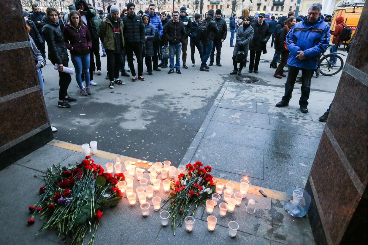 Flowers and candles in memory of the St. Petersburg Metro explosion victims on Monday at Sennaya station.
