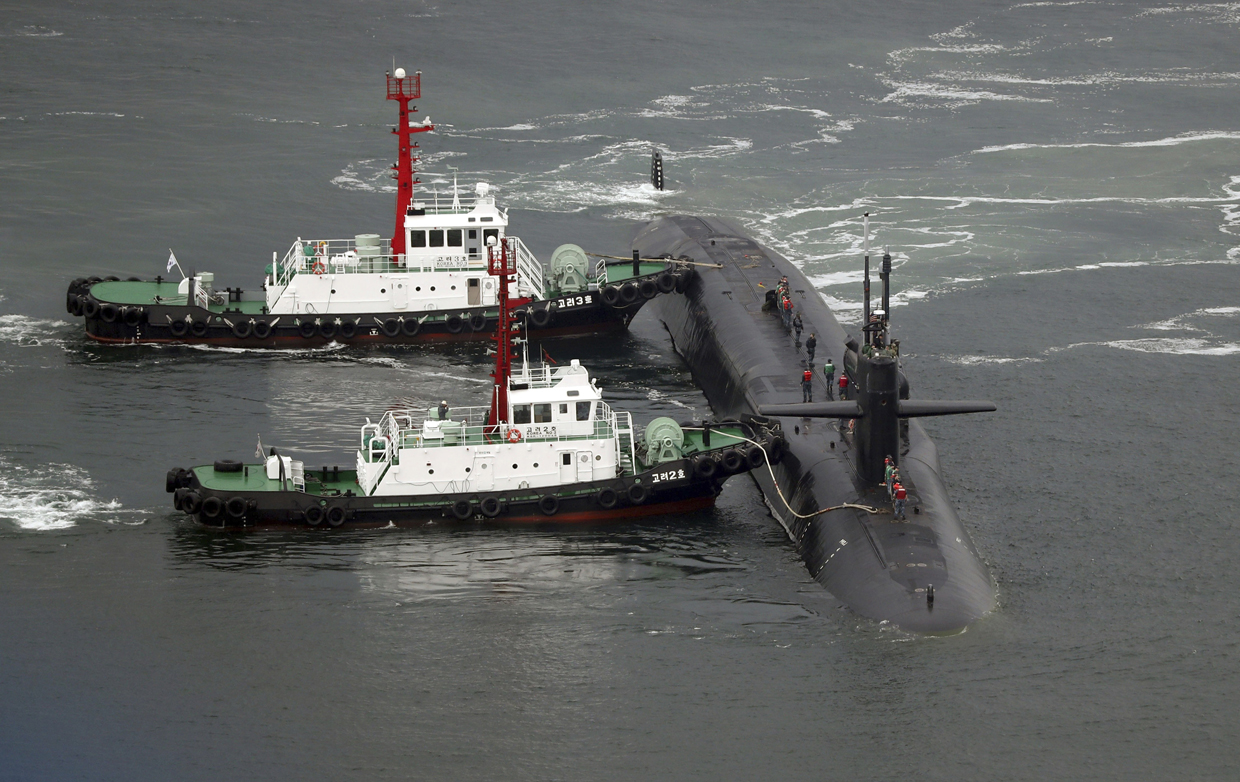 The nuclear-powered submarine USS Michigan approaches to join the U.S. aircraft carrier USS Carl Vinson in drills near the Korean Peninsula, at Busan port in Busan, South Korea, Tuesday, April 25, 2017. North Korea marks the founding anniversary of its military on Tuesday, and South Korea and its allies are bracing for the possibility that it could conduct another nuclear test or launch an intercontinental ballistic missile for the first time. (Jo Jung-ho/Yonhap via AP)