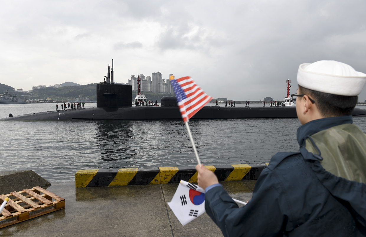 In this Monday, April 24, 2017 photo released by the U.S. Navy, the Ohio-class guided-missile submarine USS Michigan is greeted as it arrives in Busan, South Korea, for a scheduled port visit while conducting routine patrols throughout the western Pacific. (Mass Communication Specialist 2nd Class Jermaine Ralliford/U.S. Navy via AP)