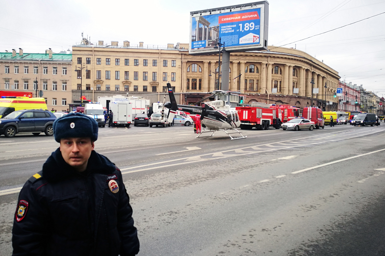 Emergency vehicles and a helicopter are seen at the entrance to Technological Institute metro station in Saint Petersburg on April 3, 2017. A blast hit the metro system of Russia's second city Saint Petersburg Monday, authorities said, with news agencies quoting security sources as saying that about ten people have been killed. / AFP PHOTO / Ruslan SHAMUKOV (Photo credit should read RUSLAN SHAMUKOV/AFP/Getty Images)