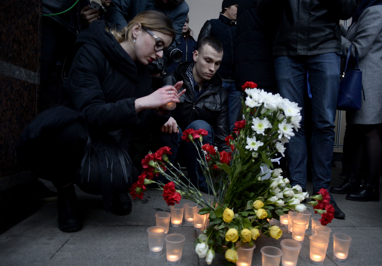 People place flowers and lit candles in memory of victims of the blast in the Saint Petersburg metro outside Sennaya Square station on April 3, 2017. Ten people were killed and several more injured Monday after an explosion rocked the metro system in Russia's second city Saint Petersburg, and authorities launched a probe into suspected "act of terror". / AFP PHOTO / Olga MALTSEVA (Photo credit should read OLGA MALTSEVA/AFP/Getty Images)