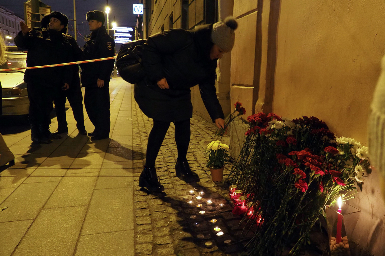 A woman places flowers in memory of victims of the blast in the Saint Petersburg metro outside Technological Institute station on April 3, 2017. Ten people were killed and several more injured Monday after an explosion rocked the metro system in Russia's second city Saint Petersburg, and authorities launched a probe into suspected "act of terror". / AFP PHOTO / Ruslan Shamukov (Photo credit should read RUSLAN SHAMUKOV/AFP/Getty Images)