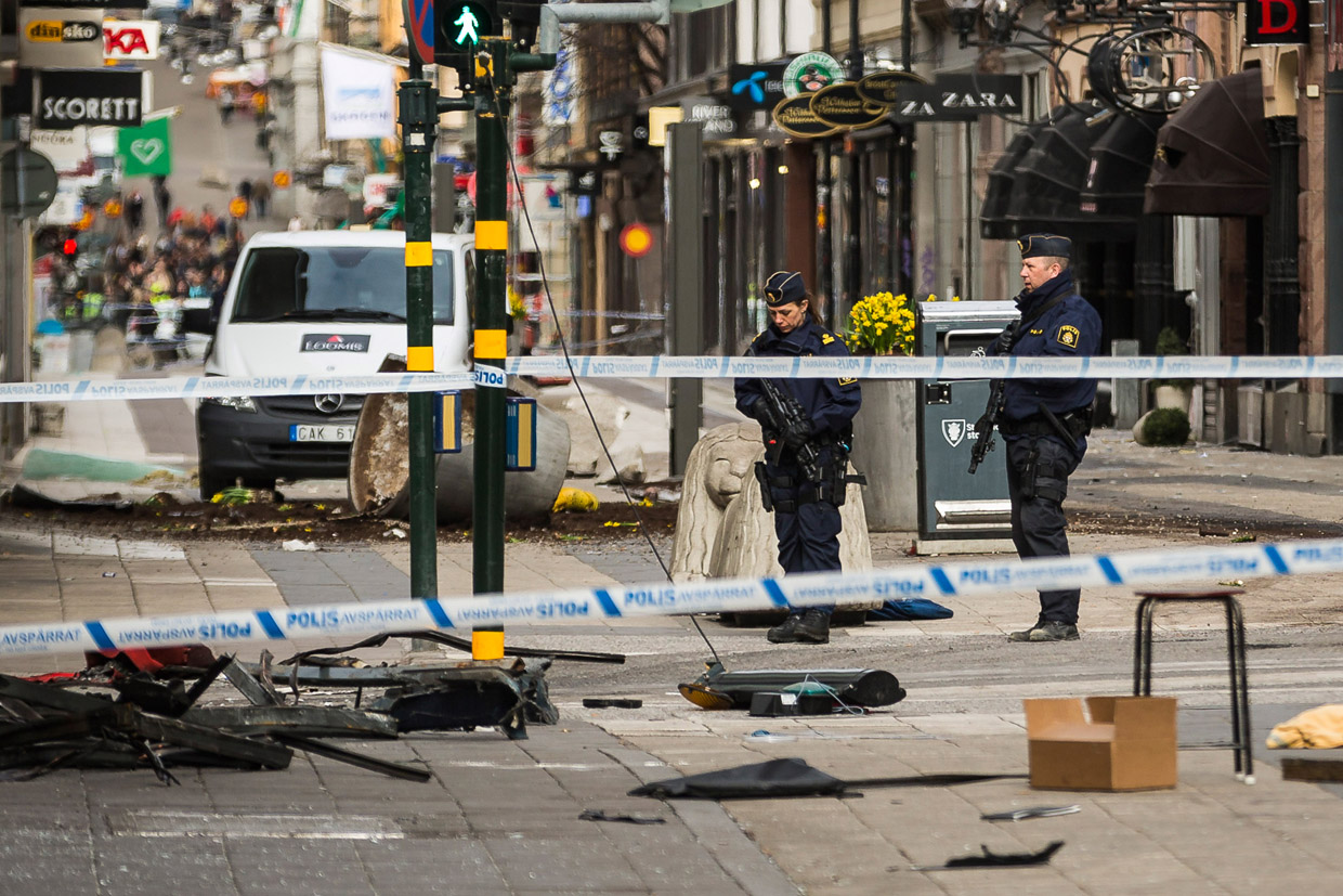 STOCKHOLM, SWEDEN - APRIL 08: Police attend the scene of the terrorist attack where a truck crashed after driving down a pedestrian street in downtown Stockholm on April 8, 2017 in Stockholm, Sweden. A suspect has been detained following the attack after four people were killed and 15 injured when the hijacked truck crashed into the front of Ahlens department store. (Photo by Michael Campanella/Getty Images)
