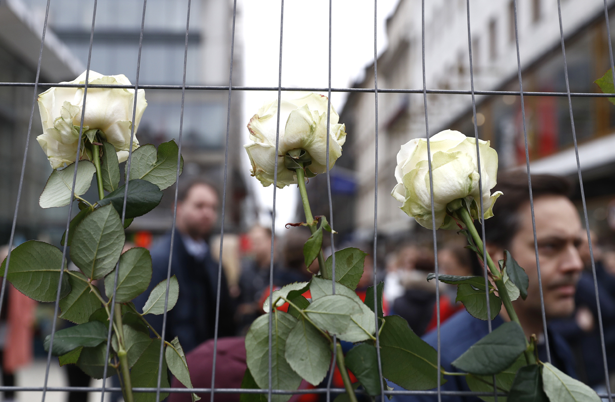 Flowers are seen at a makeshift memorial near the scene where a truck slammed the day before into a crowd of people outside a busy department store in central Stockholm, on April 8, 2017. / AFP PHOTO / Odd ANDERSEN (Photo credit should read ODD ANDERSEN/AFP/Getty Images)