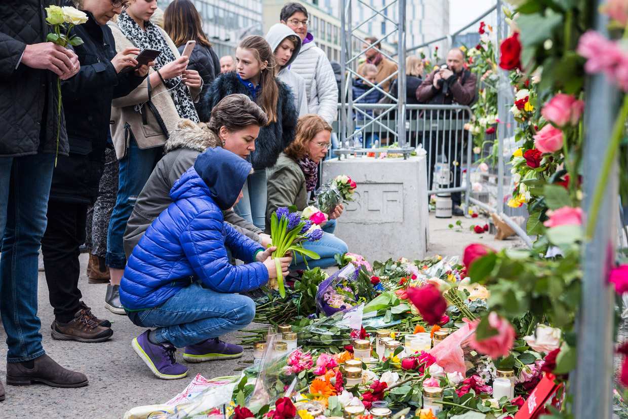 STOCKHOLM, SWEDEN - APRIL 08: Floral tributes are left at the scene of the terrorist attack where a truck crashed after driving down a pedestrian street in downtown Stockholm on April 8, 2017 in Stockholm, Sweden. A suspect has been detained following the attack which killed four people and injured another 15 when the hijacked truck crashed into the front of Ahlens department store. (Photo by Michael Campanella/Getty Images)